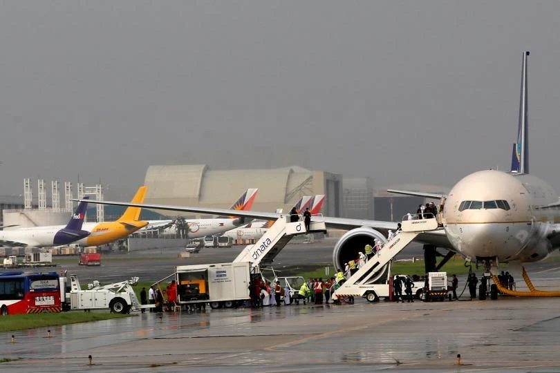 Above, passengers disembark from a Saudi Arabia Airlines plane parked at the tarmac of Ninoy Aquino International airport. Capacity at the Philippines’ main aviation gateway is at critical levels, although private sector proposals have been put forward for the airport’s expansion. (Reuters)