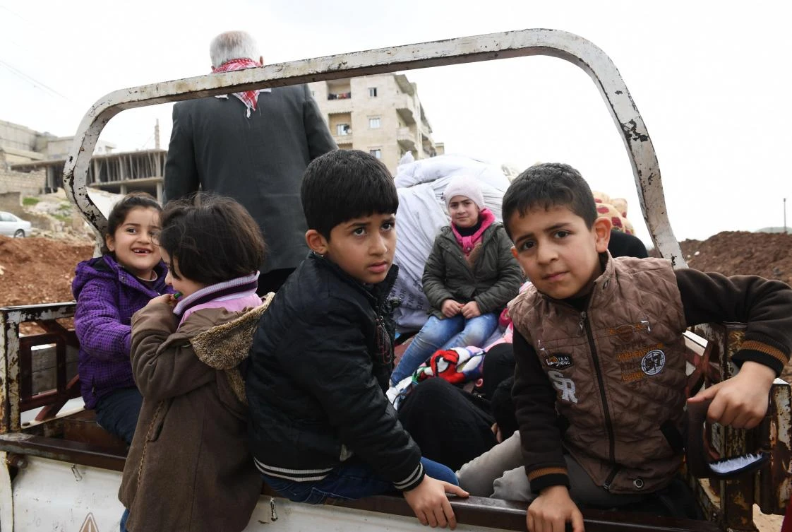 Syrian-Kurds flee the city of Afrin as Turkish-backed forces advance in the battle against Kurdish fighters on March 7, 2018. (AFP)