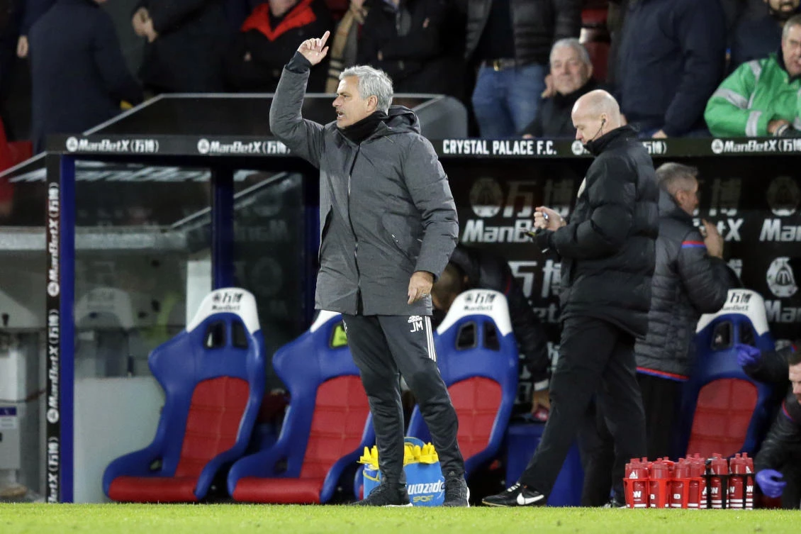 Jose Mourinho says pundits are "giving opinions like they have solutions for everything." (AP)