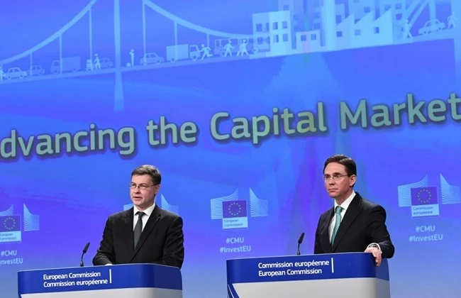 European Commission Vice Presidents Valdis Dombrovskis (L) and Jyrki Katainen address a press conference on new initiatives under the Capital Markets Union to promote sustainable finance, FinTech, and crowdfunding. (AFP)