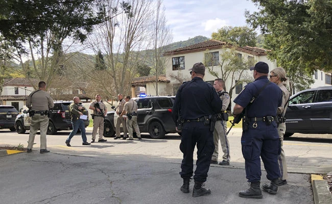 Law enforcement members stage at the Veterans Home of California after reports of an active shooter on Friday, March 9, 2018, in Yountville, California. (JL Sousa/Napa Valley Register via AP)