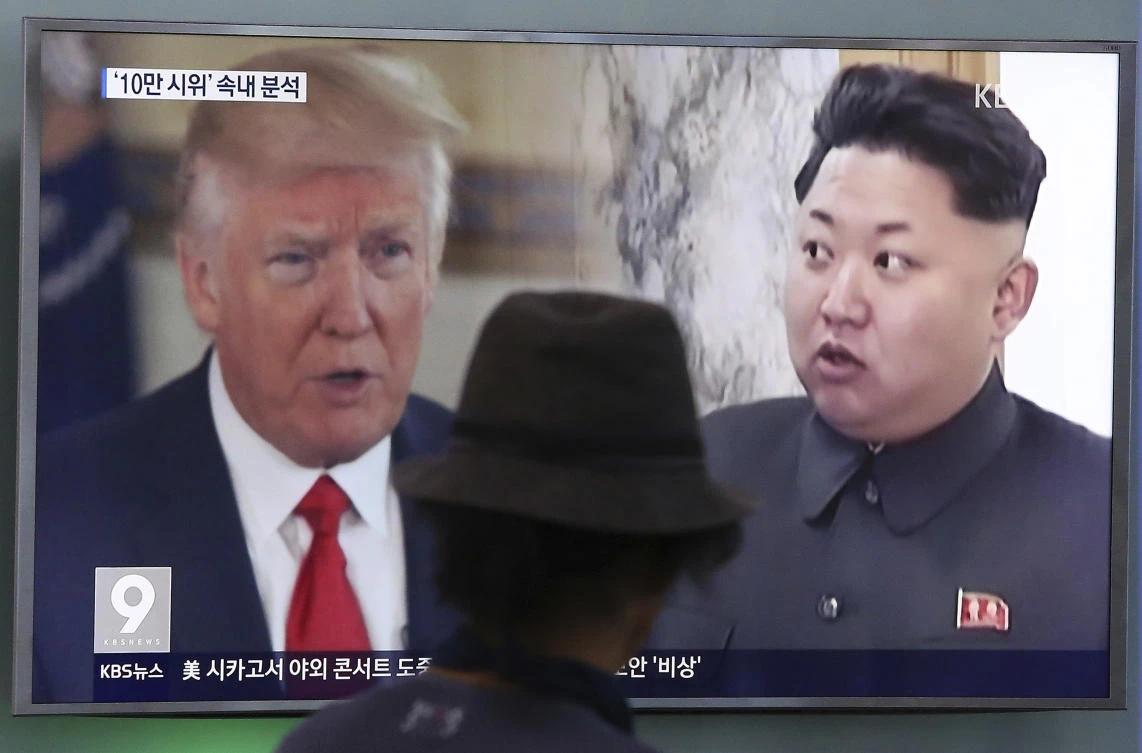 A man watches a television screen showing US President Donald Trump and North Korean leader Kim Jong Un during a news program at the Seoul Train Station in Seoul, South Korea. (AP Photo/Ahn Young-joon, File)