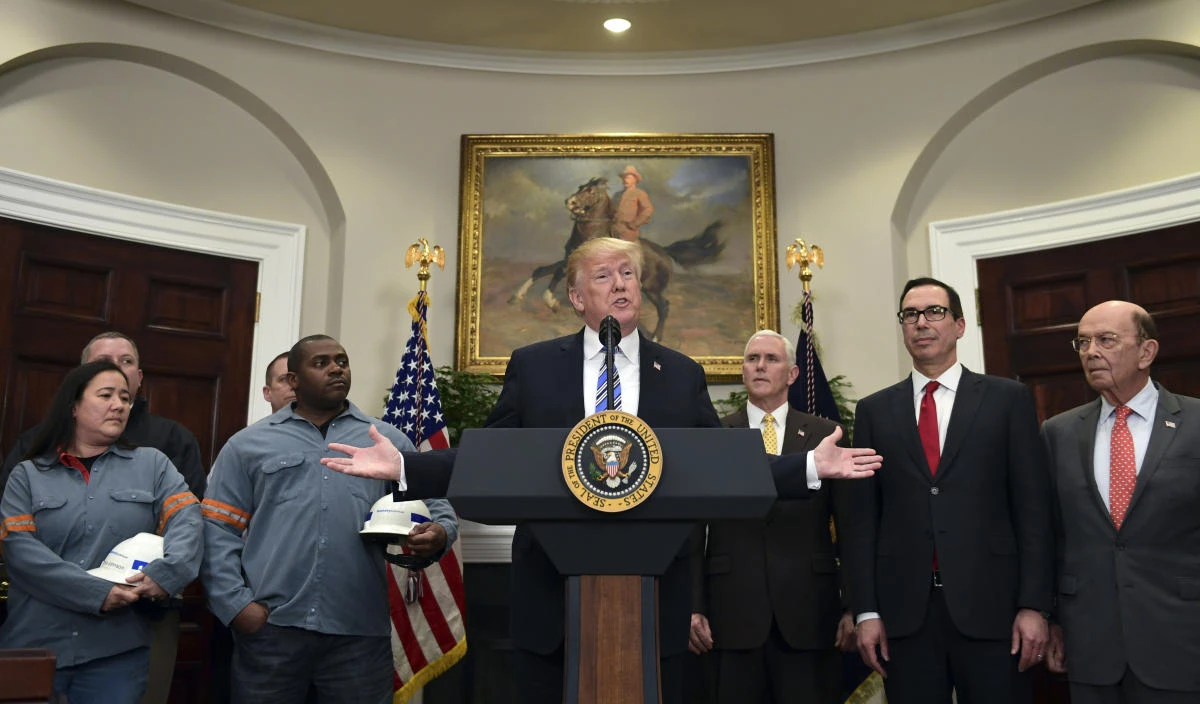 President Donald Trump, center, speaks in the Roosevelt Room of the White House in Washington. (AP)