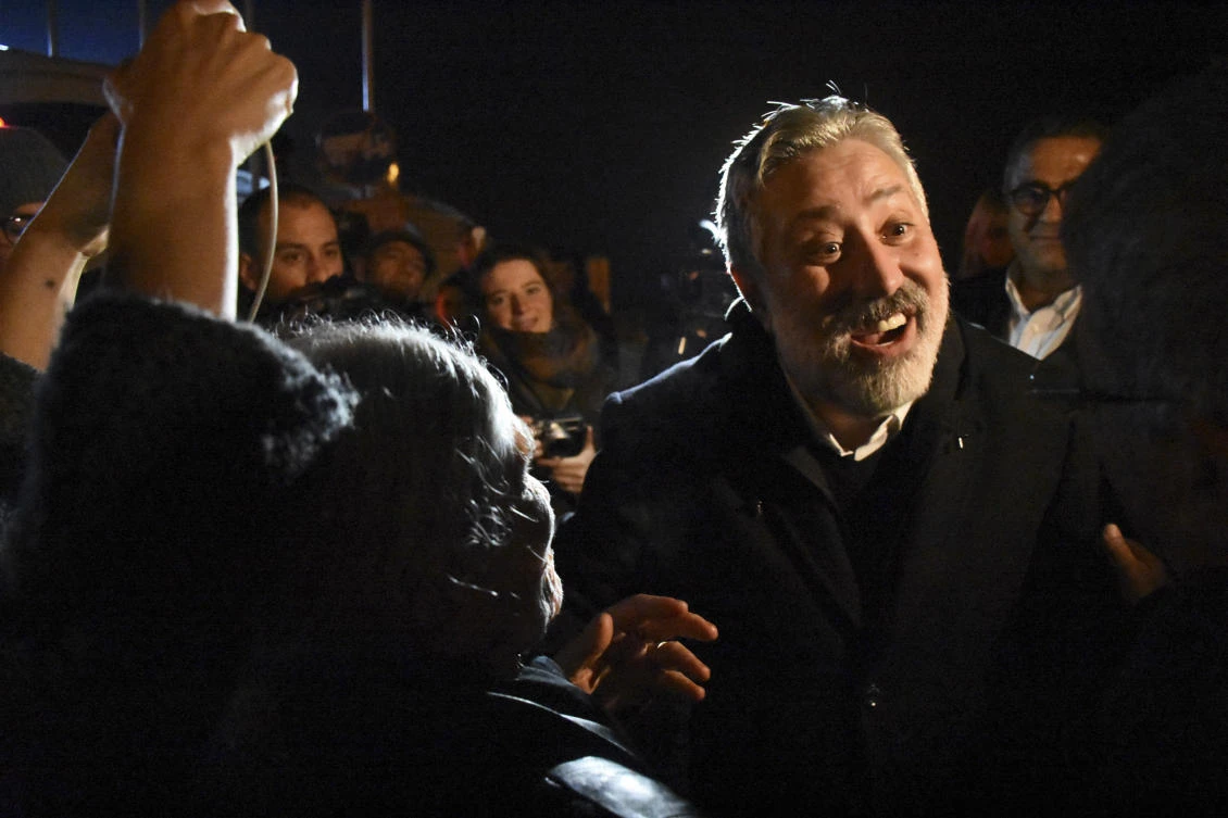 Murat Sabuncu, Cumhuriyet's opposition newspaper editor-in-chief, smiles after released from the prison complex in Silivri, Turkey. (Cemil Ozdemir/DHA-Depo Photos via AP)