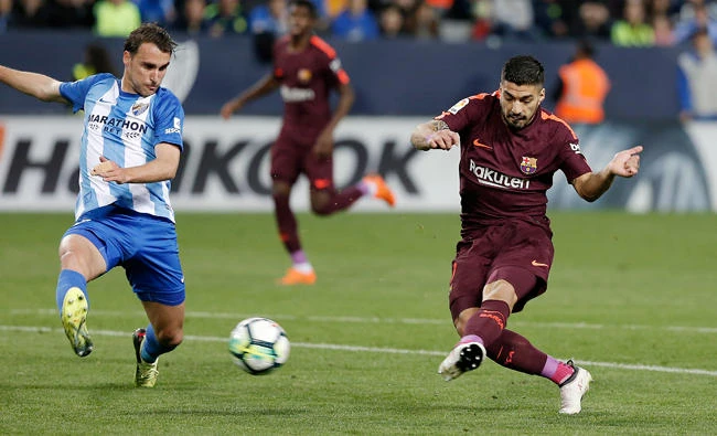 Barcelona were too good for 10-man Malaga. (AP)