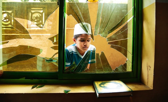 Sri Lanka to probe anti-Muslim riots, lift curfew
