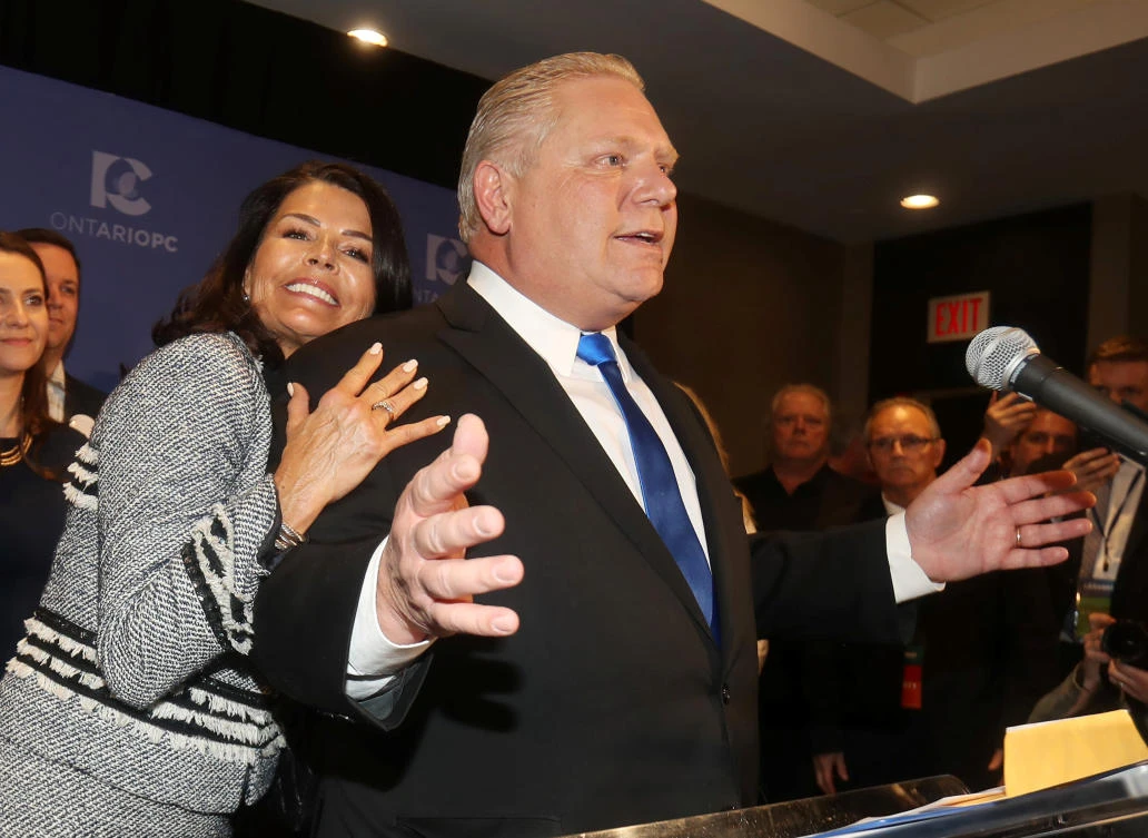 Progressive Conservatives leadership race candidate winner Doug Ford speaks with his wife Karla in Markham, Ontario, Canada, March 10, 2018. (Reuters/Fred Thornhill)