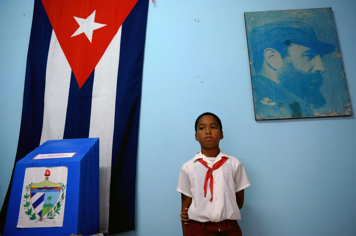 In this file photo a schoolboy remains standing at a polling station at Nautico neighborhood in Havana during municipal elections. Cubans vote on March 11, 2018, for 605 members to the National Assembly who will be elected, among them, the successor of President Raul Castro. (AFP/Yamil Lage)