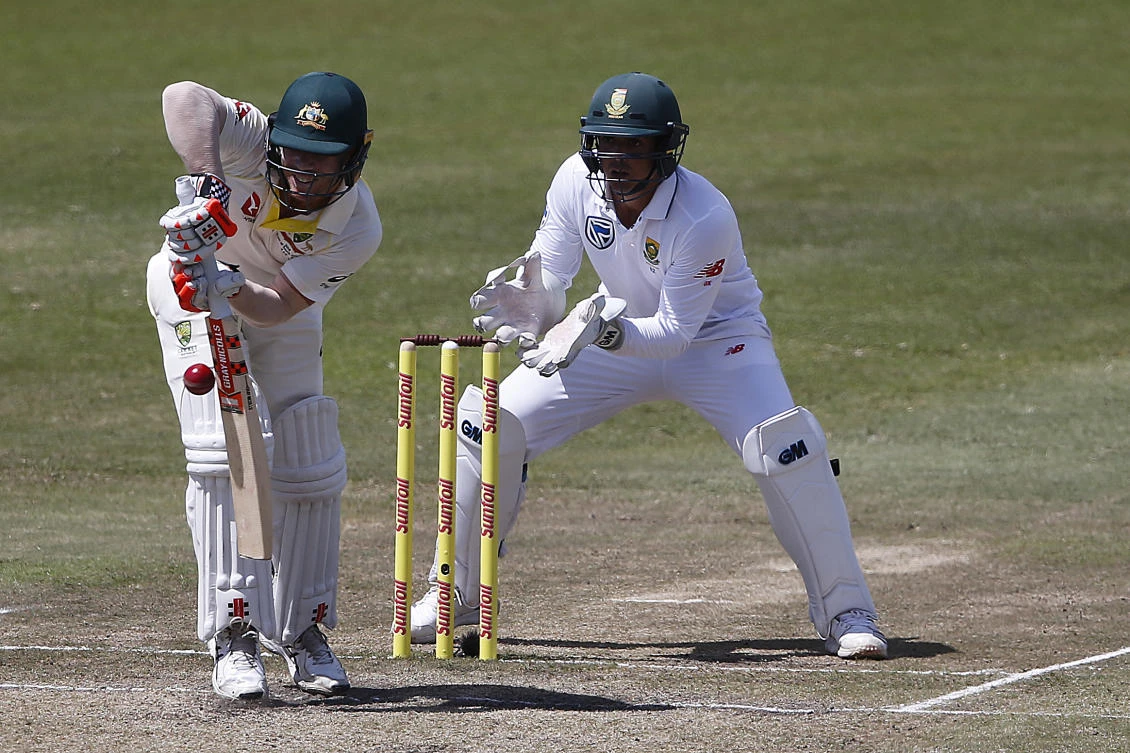 Australia's David Warner batting under the watchful eye of South Africa's wicket keeper Quinton de Kock. (AFP)
