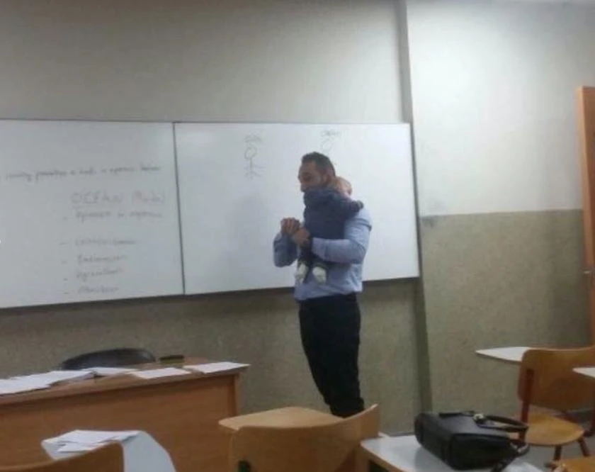 Photos of Lebanese professor carrying student’s baby during lecture melts hearts