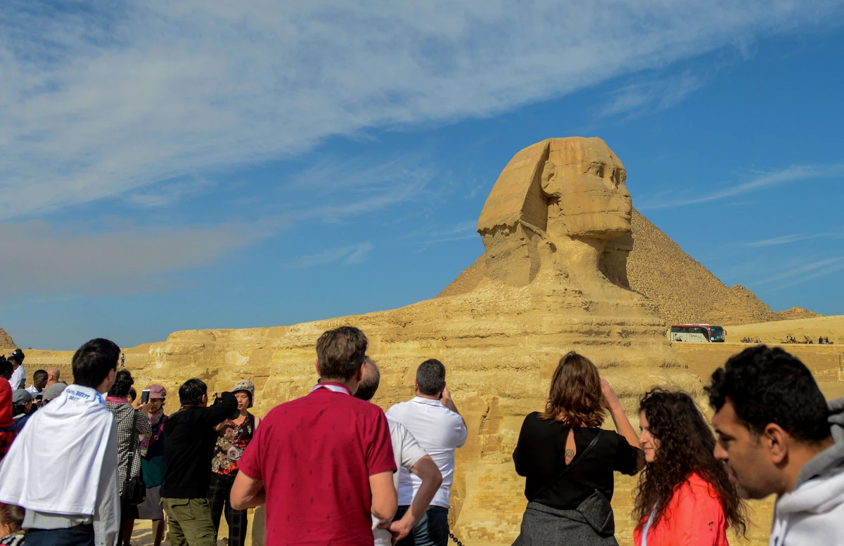 Tourists take pictures of the Sphynx during a visit to the pyramids, on the Giza Plateau, on the southern outskirts of the Egyptian capital Cairo. (AFP)