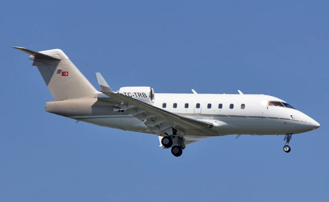 In this May 20, 2016 photo, a Bombardier CL604 aircraft descends to land in Istanbul. The Turkish private jet flying from the United Arab Emirates to Istanbul carrying a group of young women crashed Sunday night, March 11, 2018 in a mountainous region of Iran, killing all 11 people on board, authorities said. (AP Photo/Yigit Cicekci)