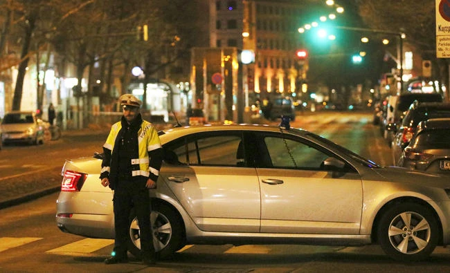 An officer blocks a street when police is on the hunt for an attacker after several people have been injured in a knife attack on the streets of Vienna, Austria, in this March 7, 2018 photo. (AP)