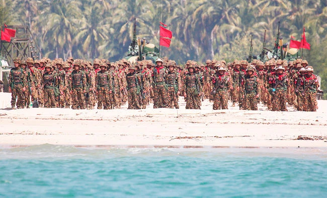 Myanmar military troops stand in formation along the shore during the second day of 'Sin Phyu Shin' joint military exercises in Ayeyarwaddy delta region, in this February 3, 2018 photo. (AFP)