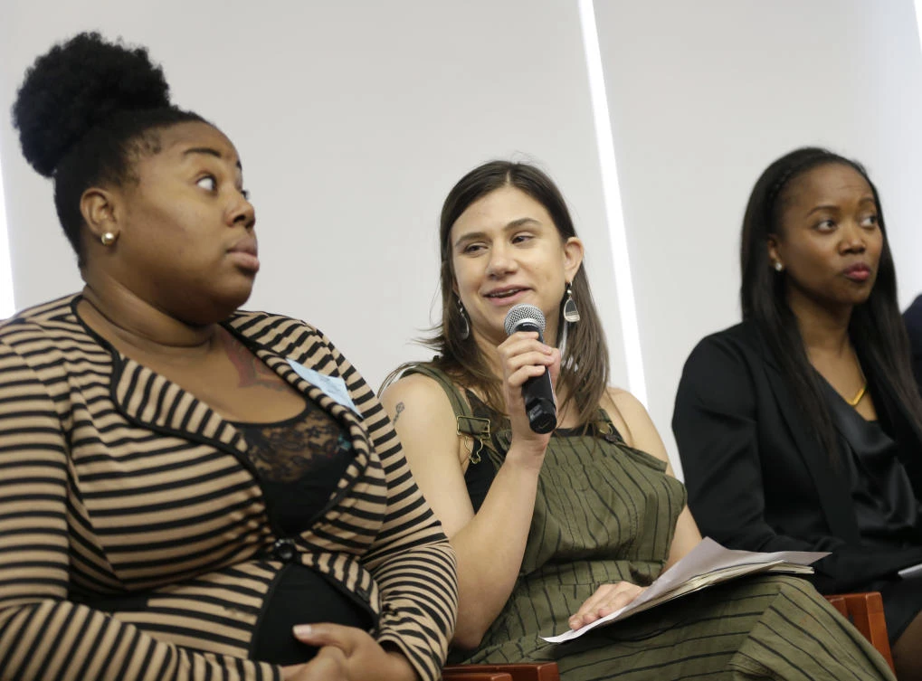 Gemma Rossi, center, recounts some of the indignities working for tips at a restaurant during a discussion about subminimum wage workers in New York. (AP)