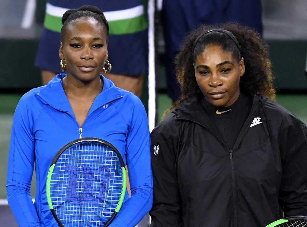 Venus Williams and Serena Williams pose for a photo before their match against each other during the BNP Paribas Open at the Indian Wells Tennis Garden on March 12, 2018 in Indian Wells, California. (AFP)