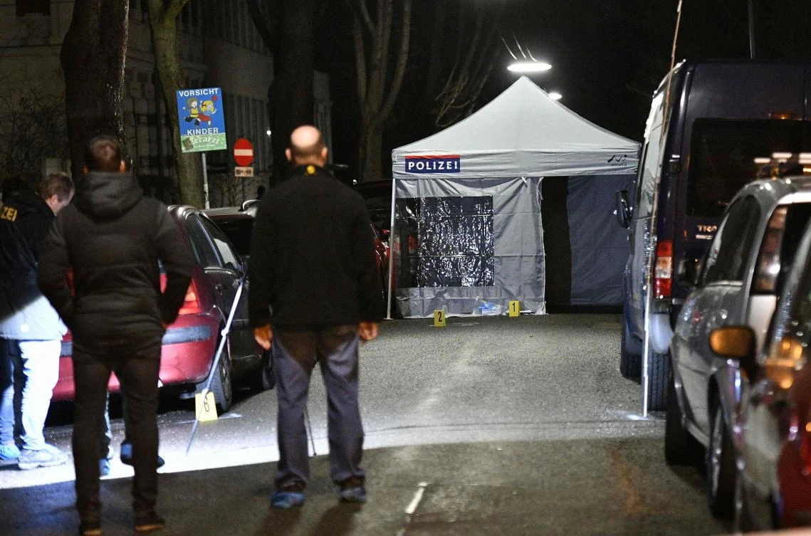 Police officers gather outside the Iranian ambassador's residence in Vienna on early on March 12, 2018 where a 26-year-old Austrian was shot dead after he attacked a guard with a knife. (AFP)