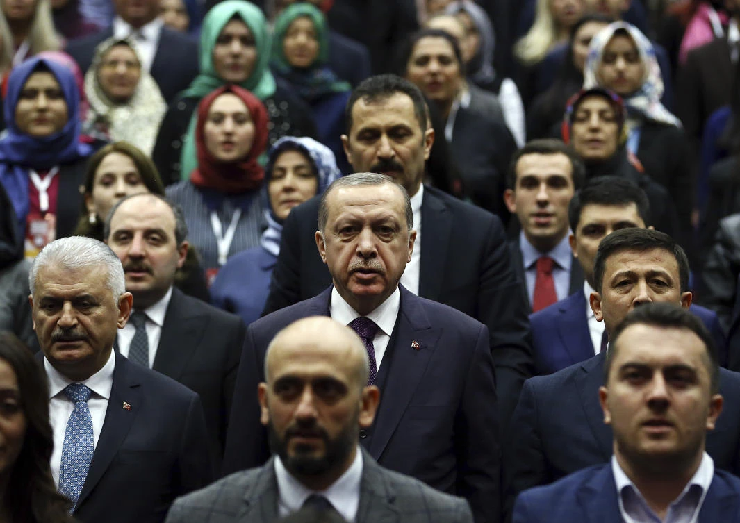 Turkey's President Recep Tayyip Erdogan, center, attends the inauguration of his ruling Justice and Development (AKP) Party's Politics Academy, in Ankara, Turkey, Friday, March 9, 2018. (AP)