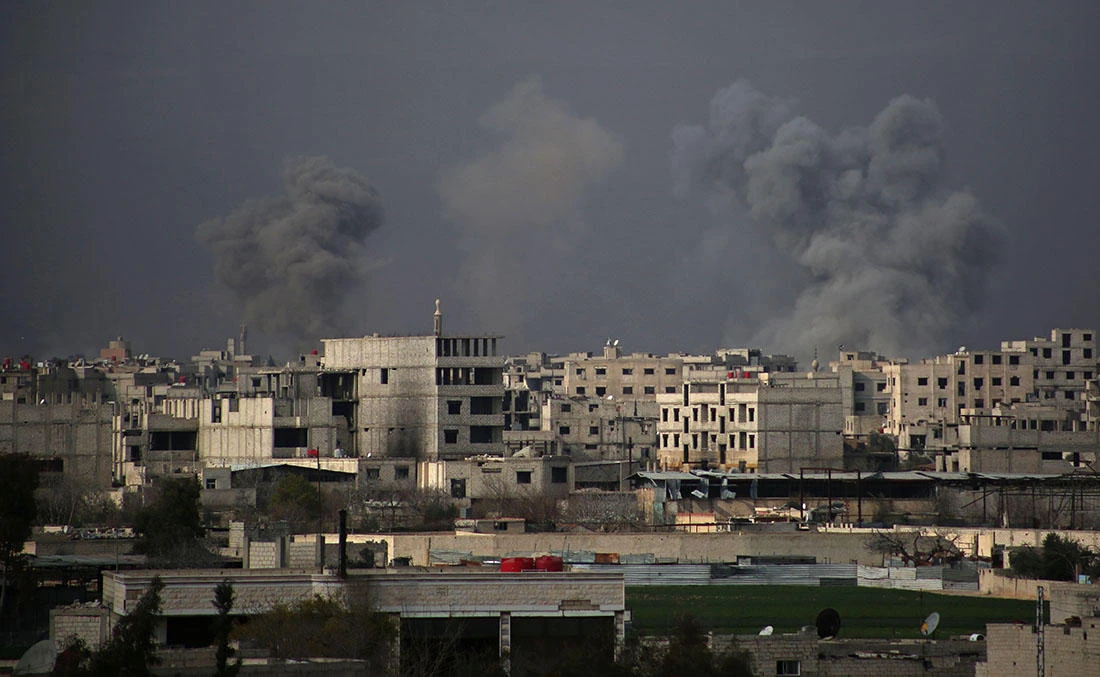 Smoke billows following Syrian government bombardment on the rebel-held besieged town of Harasta, in the Eastern Ghouta region on the outskirts of Damascus on March 10, 2018. (AFP)