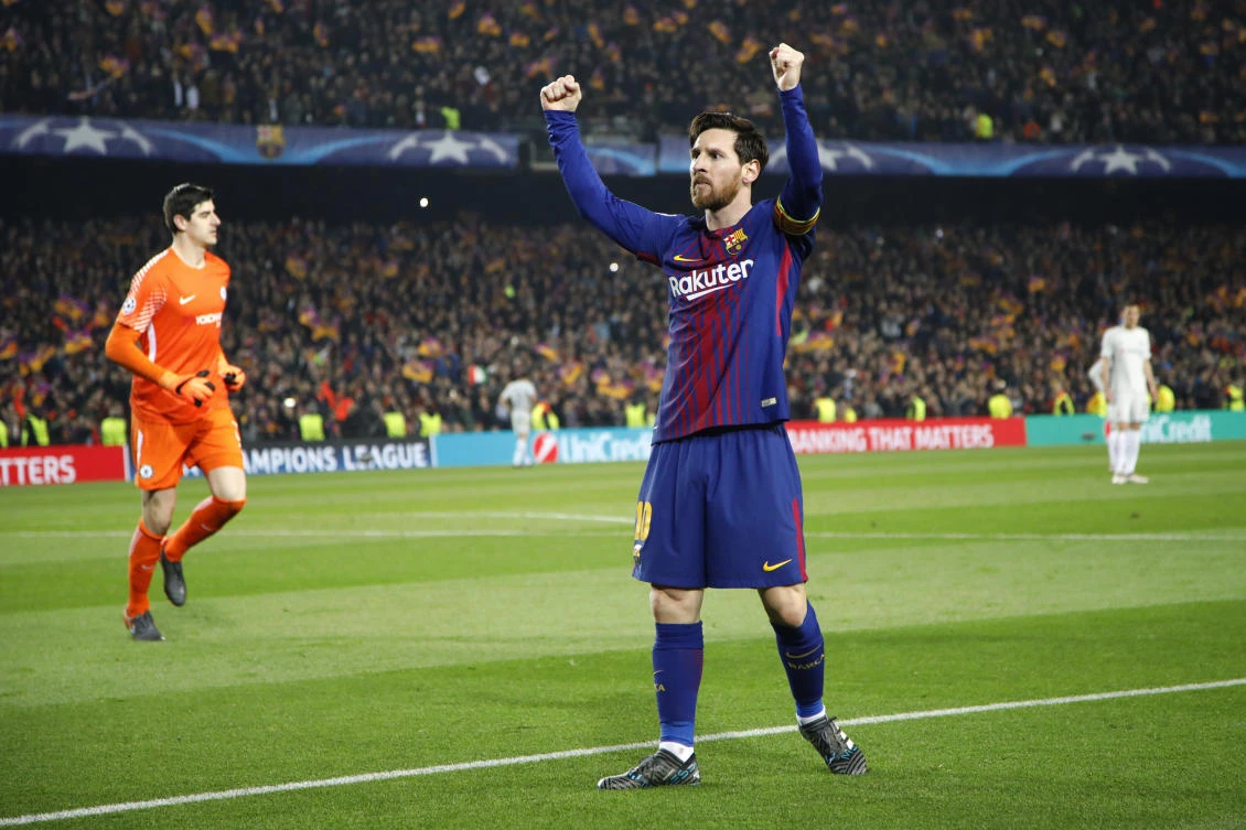 Barcelona's Lionel Messi celebrates after scoring his side's third goal as Chelsea goalkeeper Thibaut Courtois, left, stands defeated during the Champions League round of sixteen second leg. (AP)