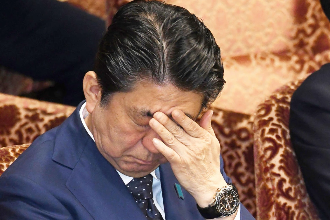 Japan PM Abe denies involvement by him, wife in discount land sale