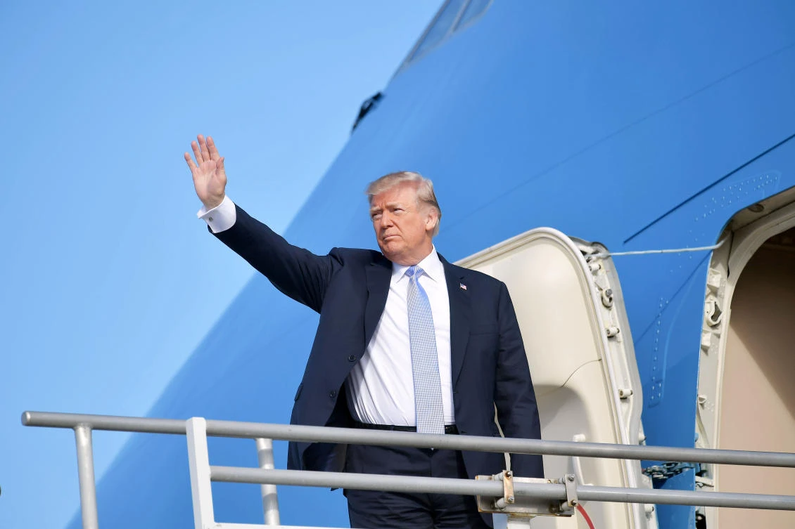 US President Donald Trump waves as he boards Air Force One before departing from Los Angeles International Airport in Los Angeles on Wednesday. (AFP)