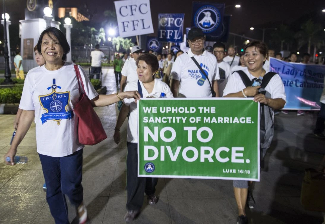 A group of Filipino faithful hold a banner as they take part in a “Walk for Life” protest at a park in Manila. Heavily Catholic Philippines and the Vatican are the last two places on Earth where divorce is outlawed. (AFP)