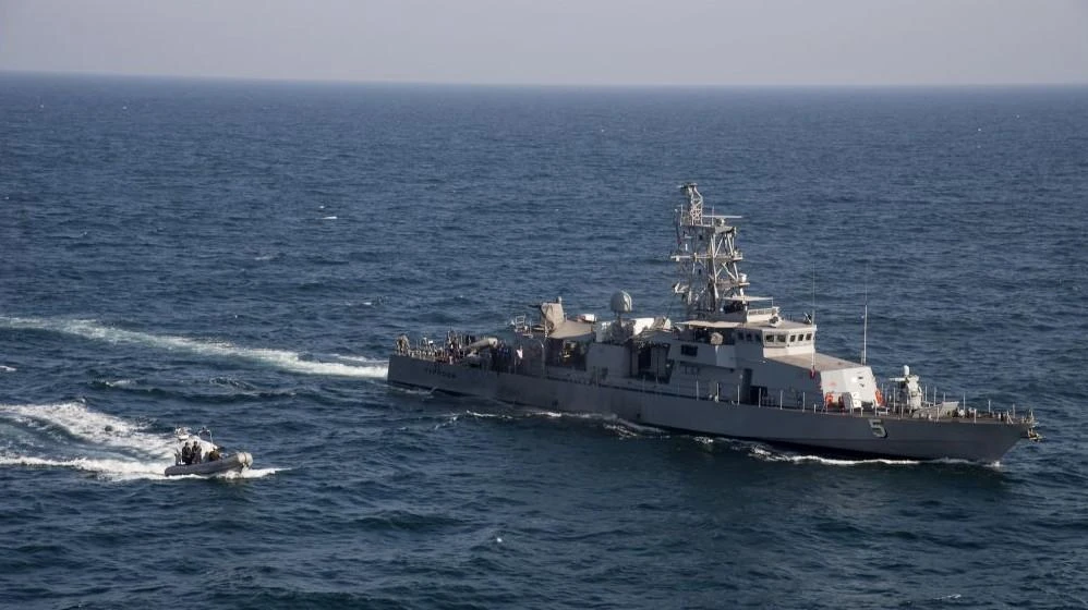 A rigid hull inflatable boat transits alongside the coastal patrol ship USS Typhoon during a vertical onboard exercise in the Arabian Gulf, February 2014. (AP)