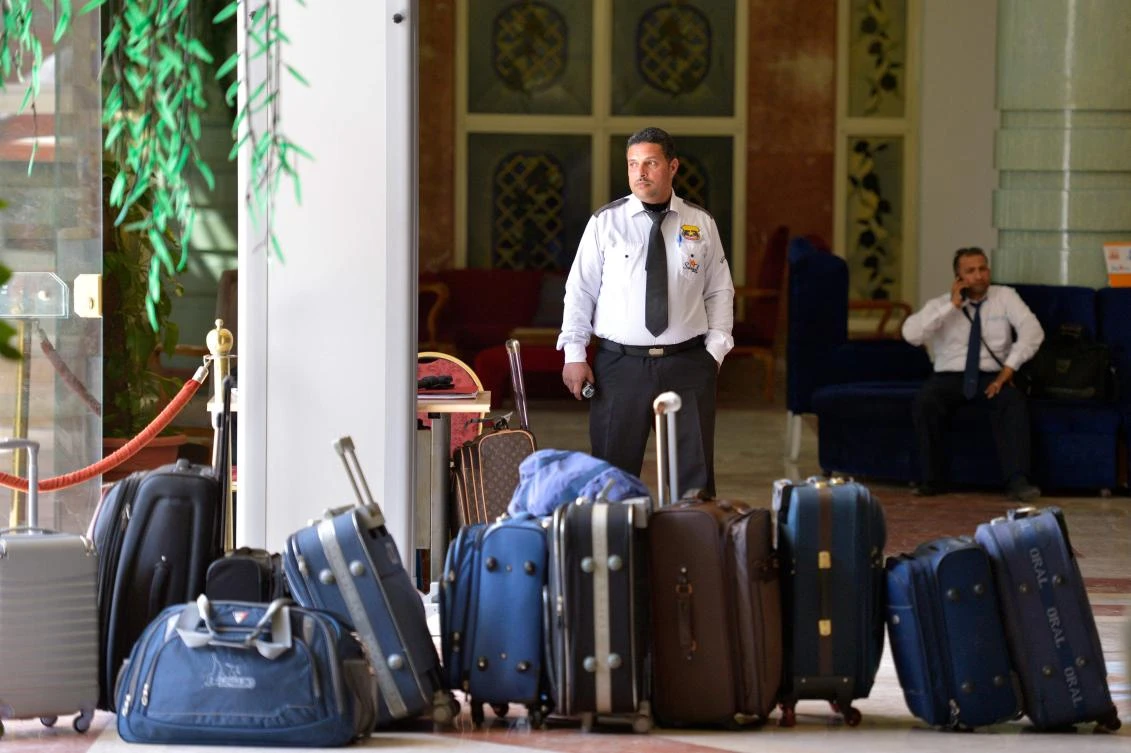 An Egyptian hotel employee stands next to suitcases at a hotel in the Red Sea resort of Hurghada. The number of visitors to Egypt was up to 8.3 million people last year. (AFP)