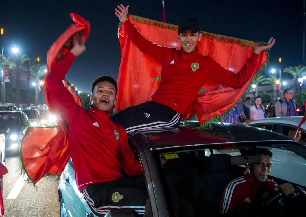 Morocco fans celebrate qualifying for this summer's World Cup. Morocco could be celebrating again if they land the 2026 tournament. (AFP)