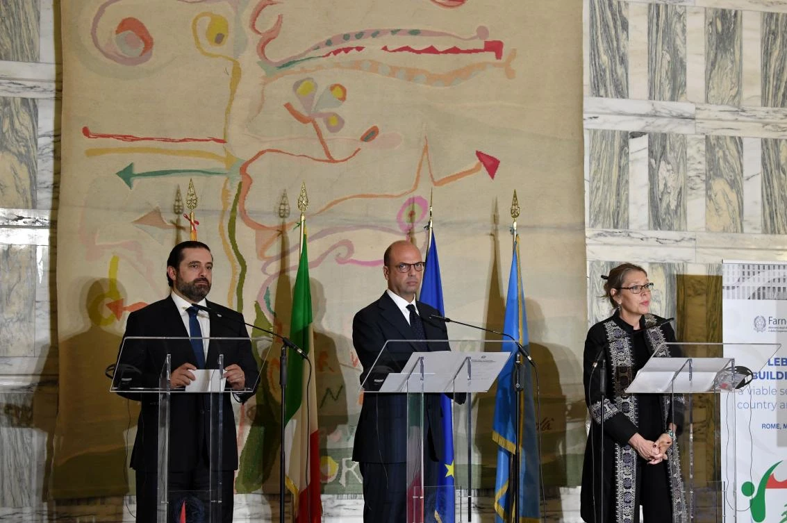 Italian Foreign Minister Angelino Alfano (C) stands along side Lebanese Prime Minister Saad Hariri (L) and UN Special Coordinator for Lebanon Pernille Dahler Kardel, during a joint press conference on the support pledged to the Lebanese security forces, Farnesina palace, in Rome on Mar15, 2018. (AFP)