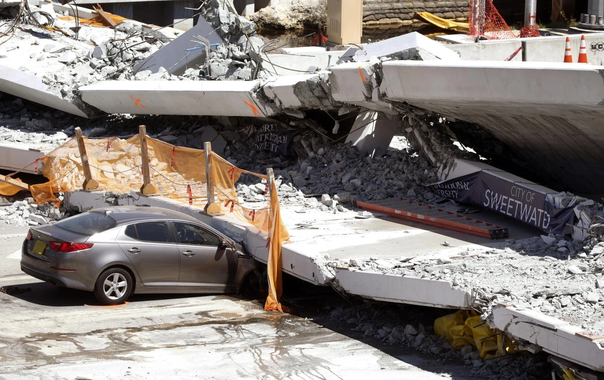 Tearful families wait as bodies remain under failed Miami bridge