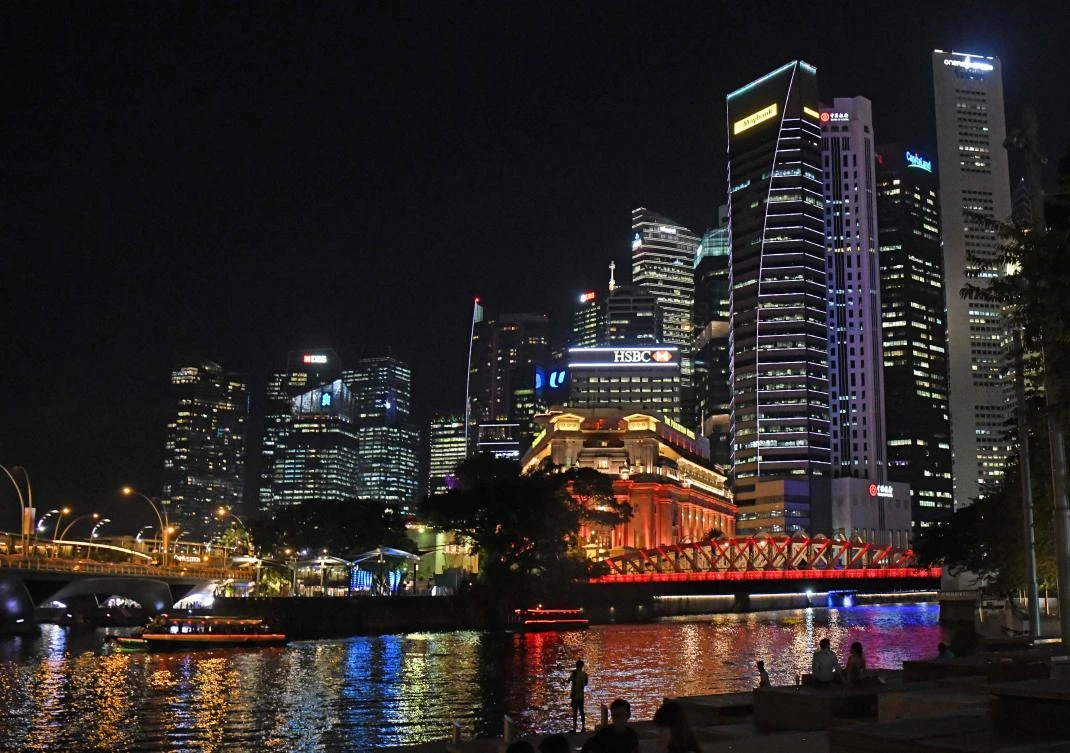 The bright lights of Singapore’s financial district. The government is keen to curb rampant property market speculation. (AFP)