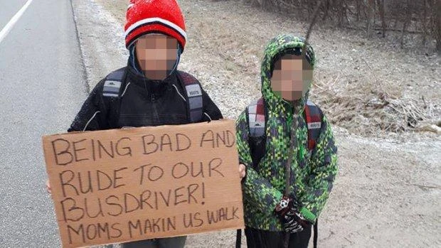 Mother sends children on walk of shame to school through snow carrying signs confessing their rudeness to bus driver