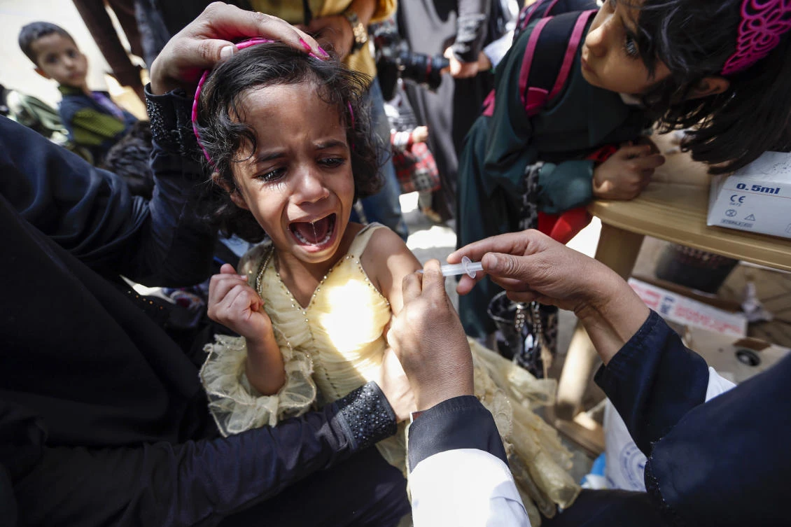 A Yemeni child receives a diphtheria vaccine at a health center. (AFP)