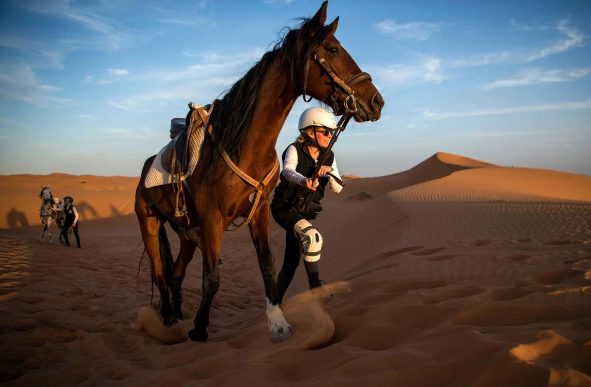 A rider competes during the “Gallops of Morocco” equestrian race in the desert of Merzouga in the southern Moroccan Sahara desert on March 1, 2018. (AFP)
