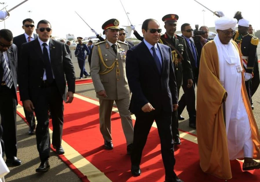 Sudan's President Omar Al-Bashir welcomes Egypt's President Abdel Fattah El-Sisi in Khartoum. (REUTERS)