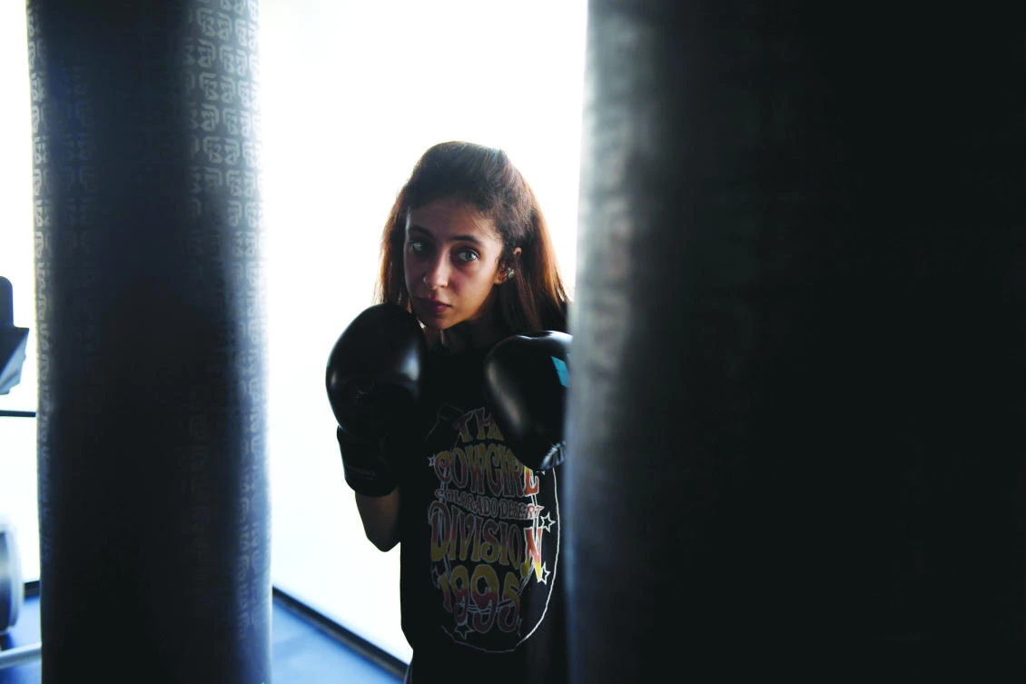 Pioneering boxing coach Halah Al-Hamrani is empowering and getting fit a new generation of women at her gym in Jeddah. (AFP)