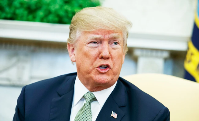In this March 15, 2018, file photo, President Donald Trump talks with reporters during a meeting in the Oval Office of the White House in Washington. (AP)