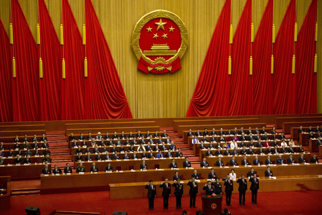 Newly-appointed officials take the oath of office during a plenary session of China’s National People’s Congress (NPC) at the Great Hall of the People in Beijing. (AP)