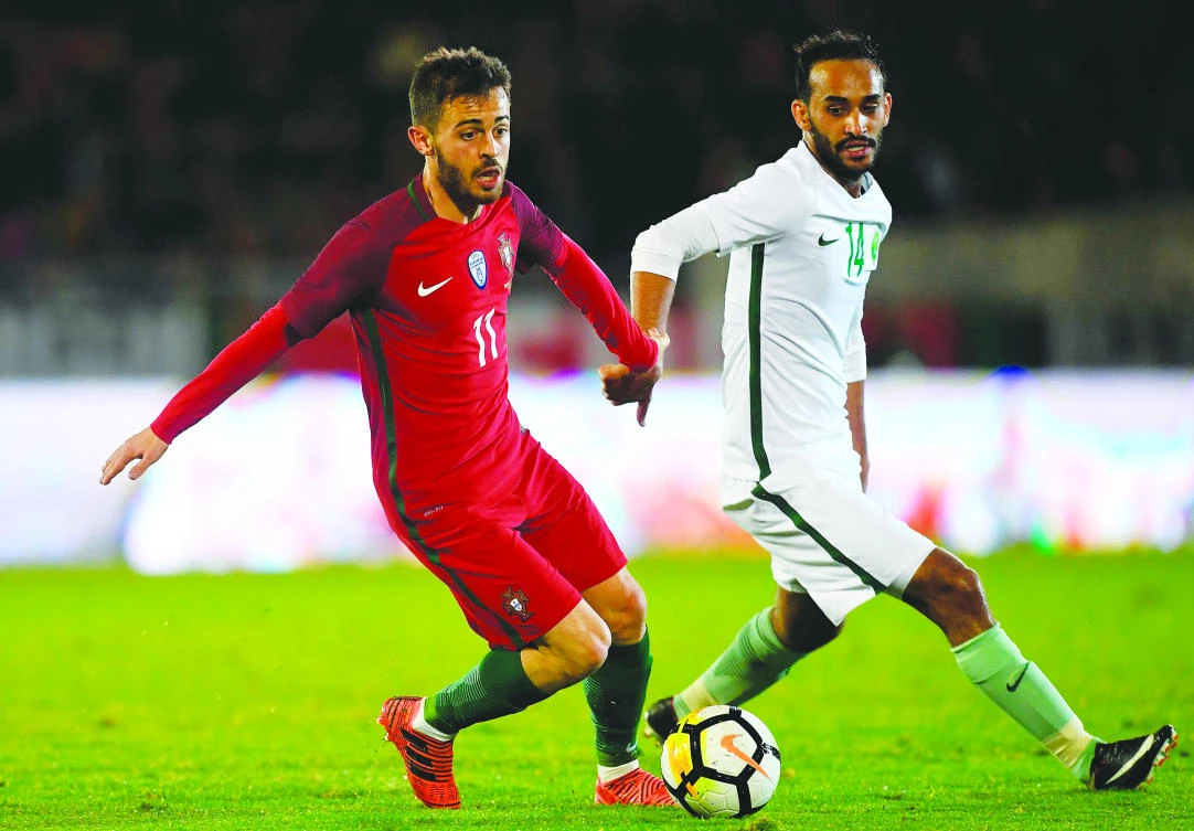 Abdullah Otayf has a chance to become the creative spark for Saudi Arabia, while the job of Osama Al-Hawsari (inset) will be to provide the ballast at the back. (AFP)