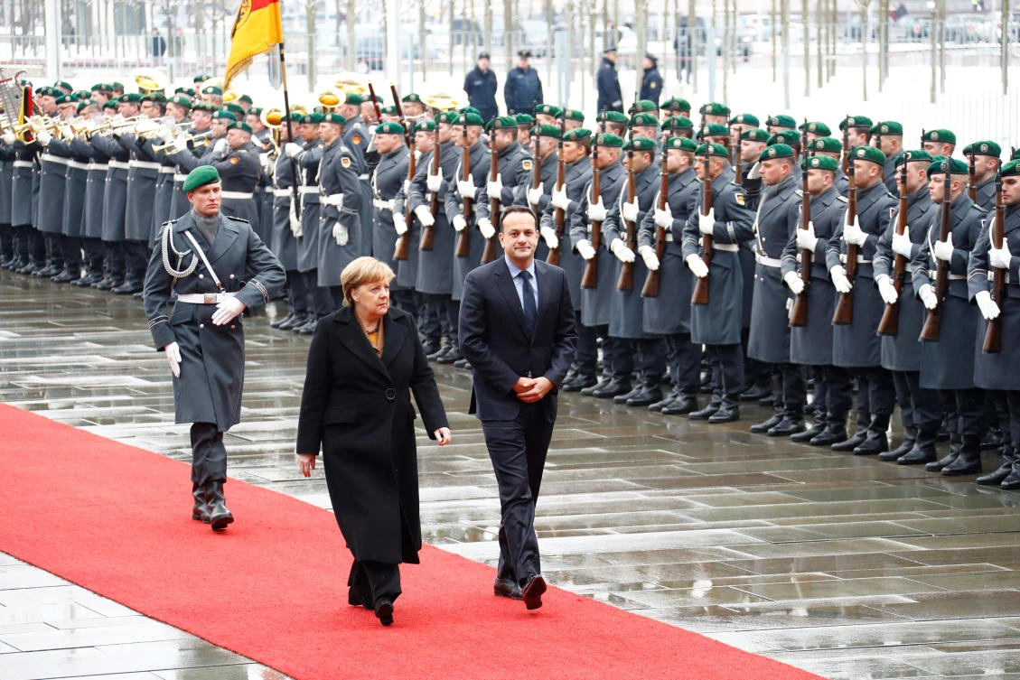 German Chancellor Angela Merkel and Irish Taoiseach Leo Varadkar review the guard of honor at the chancellery in Berlin. (Reuters)