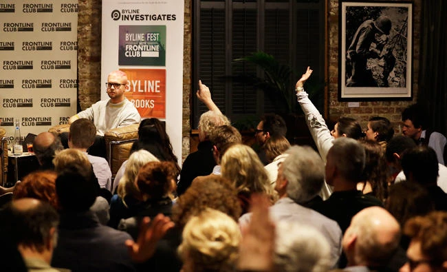 Members of the audience put up their hands during the question section at the end of a talk from Chris Wylie, from Canada, who once worked for the UK-based political consulting firm Cambridge Analytica, entitled "The Most Important Whistleblower Since Snowden: The Mind Behind Cambridge Analytica" at the Frontline Club in London, Tuesday, March 20, 2018. (AP)