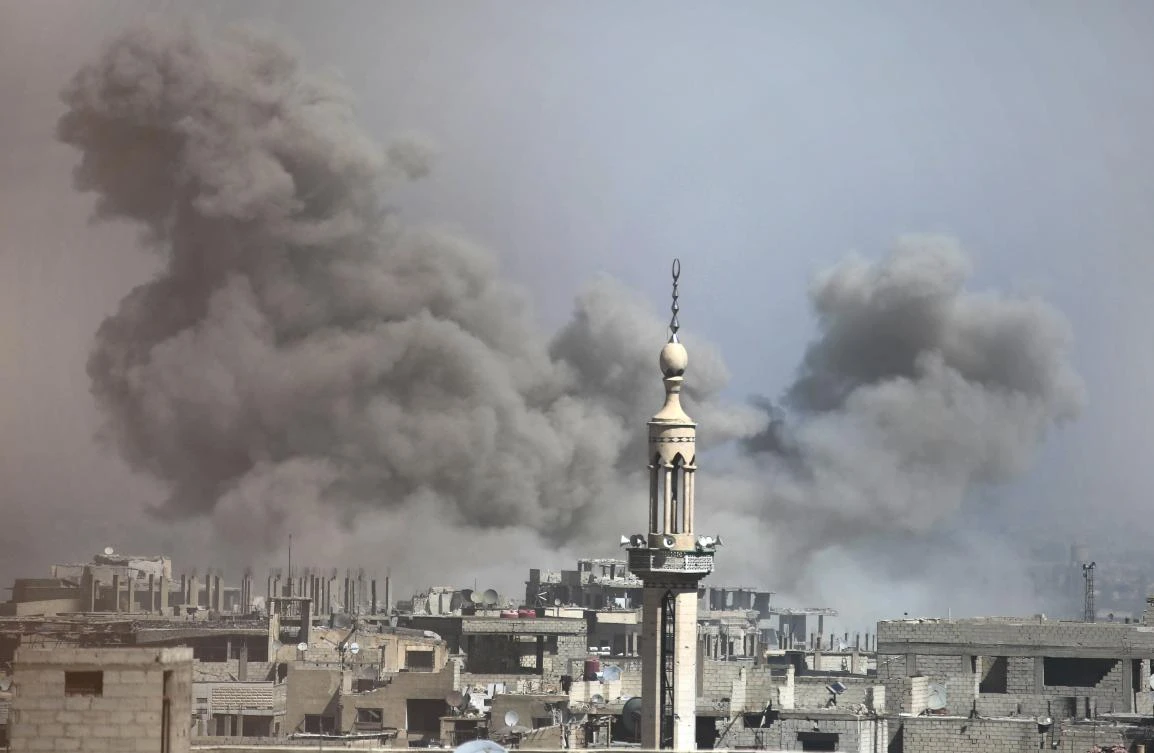 A picture taken on Tuesday shows smoke plumes rising during regime bombardment in the rebel-held town of Arbin in the Eastern Ghouta enclave outside the capital Damascus, as Syrian pro-government troops push in an offensive against it. (AFP)