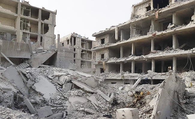 A photo taken on March 19, 2018 shows a general view of the damage in the Syrian Kurdish city of Afrin a day after Turkish-led forces entered the city. (AFP)