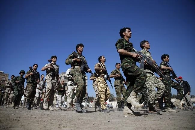 Houthi militants, dressed in army fatigues, march in a parade during a gathering in the capital Sanaa to mobilize more militants to battlefronts to fight pro-government forces in several Yemeni cities. (AFP)