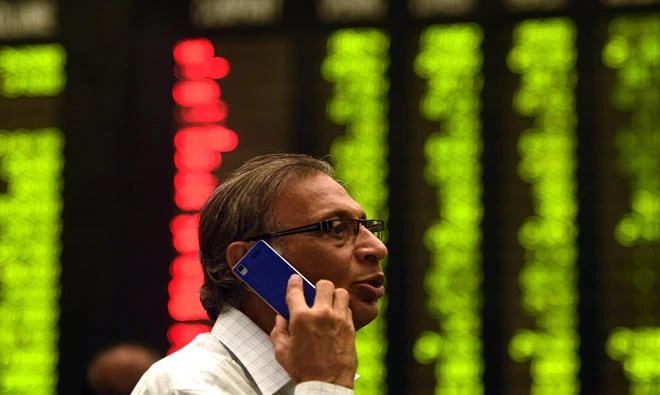 In this file photo, A Pakistani investor talks on the phone during trading at the Karachi Stock Exchange (KSE) in Karachi on Jan. 8, 2016. (AFP)