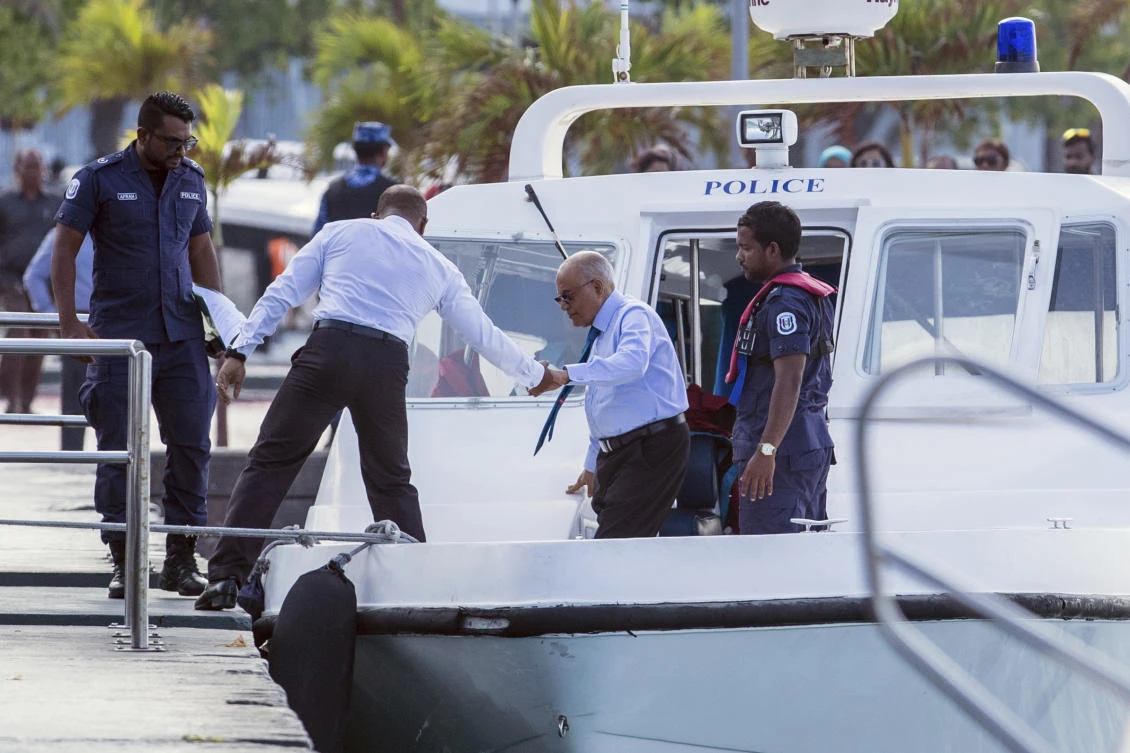 The Maldives’ former dictator Maumoon Abdul Gayoom, center, arrives for a hearing at a criminal court in Male on Wednesday, March 21. (AP)