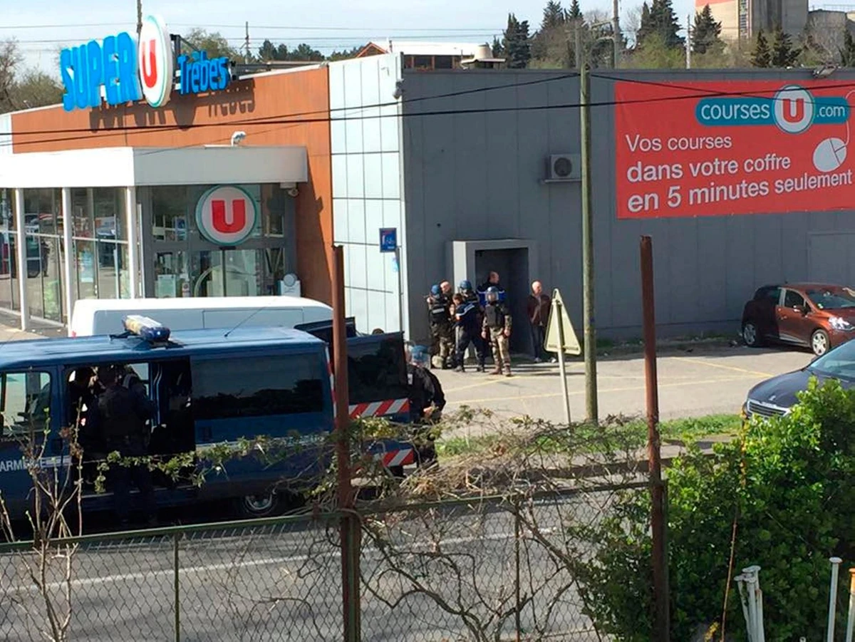 Police are seen at the scene of a hostage situation in a supermarket in Trebes, Aude, France March 23, 2018 in this picture obtained from a social media video. (Reuters)