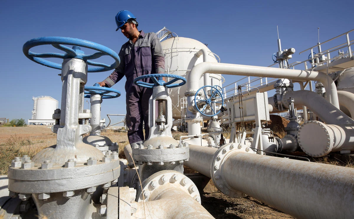 An Iraqi oil employee checks pipelines at the Bai Hassan oil field, west of the multi-ethnic northern Iraqi city of Kirkuk. (Ahmad Al-Rubaye/AFP)